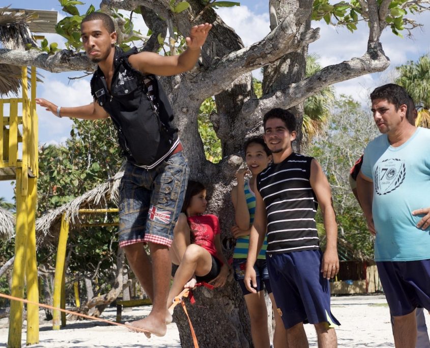 A slackline set up on the beach at Media Luna
